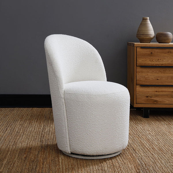 Draped in elegant beige boucle, offers a perfect blend of modern style and cozy comfort. Its graceful curves and plush fabric invite you to unwind, adding a touch of sophistication to any room. Ideal for both contemporary and classic settings, this chair 