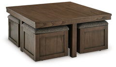 Elevate your entertainment experience with this coffee table with stools. A functional companion for your seating area, itâ€™s defined by a richly versatile finish. Instantly upgrade game days and movie nightsâ€”the four stools wheel out easily with caste