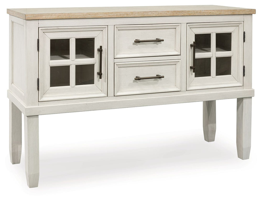 This dining server elevates the art of modern farmhouse design. Its two-tone aesthetic blends antiqued white and light grayish brown for a charming finish. Two windowpane doors with adjustable shelves and dark rustic bar pulls convey a feeling of relaxed 