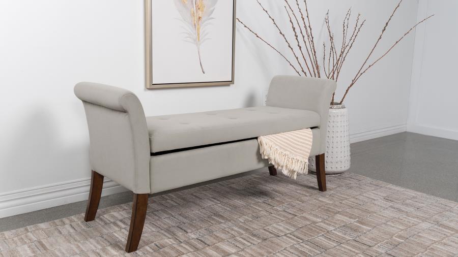 Elevate your living space with a harmonious blend of luxury and utility found in this exquisite storage bench. Adorned with a plush velvet upholstery, it boasts flared arms and meticulous button-tufting, reflecting a dedication to design and attention to 