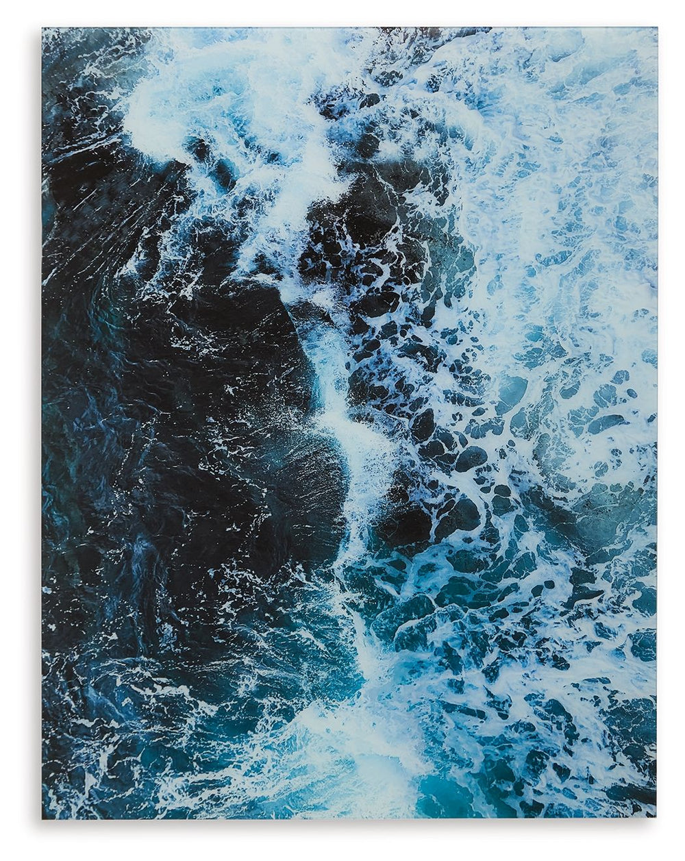 Like waves kissing the shoreline as they crash, this print on glass reminds you of the tide pulling out to sea. Swirling turquoise hues form a mesmerizing image of the ocean with foamy white caps. Perfect for ocean lovers or coastal cottages, this maritim