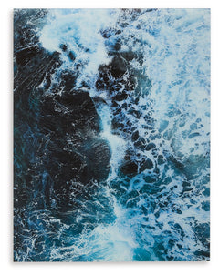 Like waves kissing the shoreline as they crash, this print on glass reminds you of the tide pulling out to sea. Swirling turquoise hues form a mesmerizing image of the ocean with foamy white caps. Perfect for ocean lovers or coastal cottages, this maritim