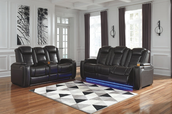 This power reclining set takes its cue from luxury automobiles with lattice- and cross-hatch stitching, for a richly tailored aesthetic that gives you plenty of reasons to celebrate. Sumptuously padded cushions and dramatic midnight black faux leather uph