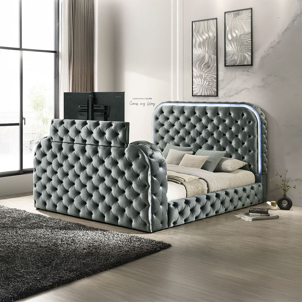 Cozy up in bed with the Kana Gray velvet bed. This bed features all the bells and whistles imaginable that make it impossible to ever leave. The built-in footboard fireplace (without heat) creates a relaxing ambiance. The footboard also houses a hidden TV