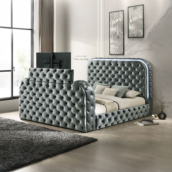 Cozy up in bed with the Kana Gray velvet bed. This bed features all the bells and whistles imaginable that make it impossible to ever leave. The built-in footboard fireplace (without heat) creates a relaxing ambiance. The footboard also houses a hidden TV