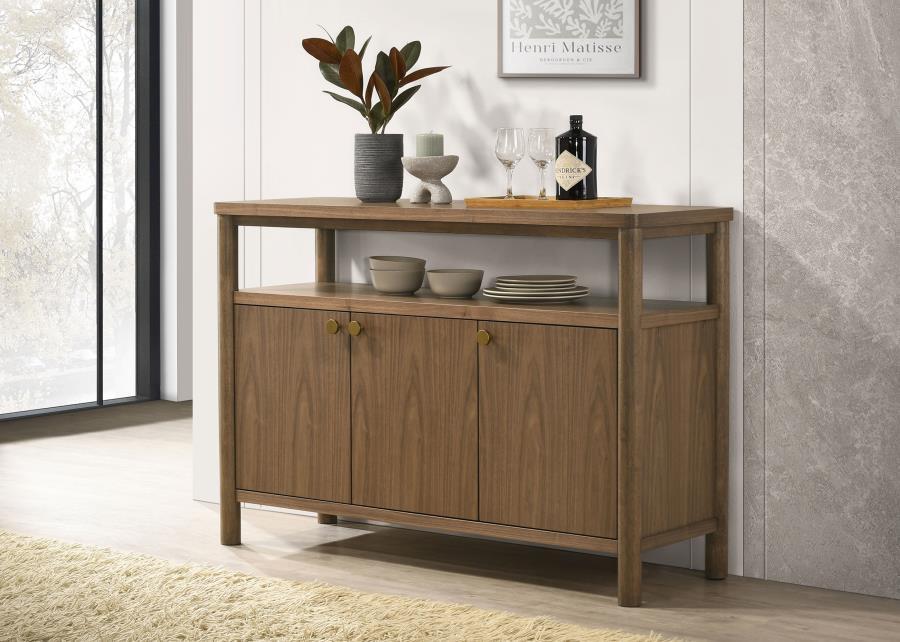 Add easy style and ample storage to your dining room with a modern wooden sideboard with three doors. An open shelf adds easy display space beneath the tabletop, perfect for seasonal accessories that enhance a personalized look and feel. The sideboard fea