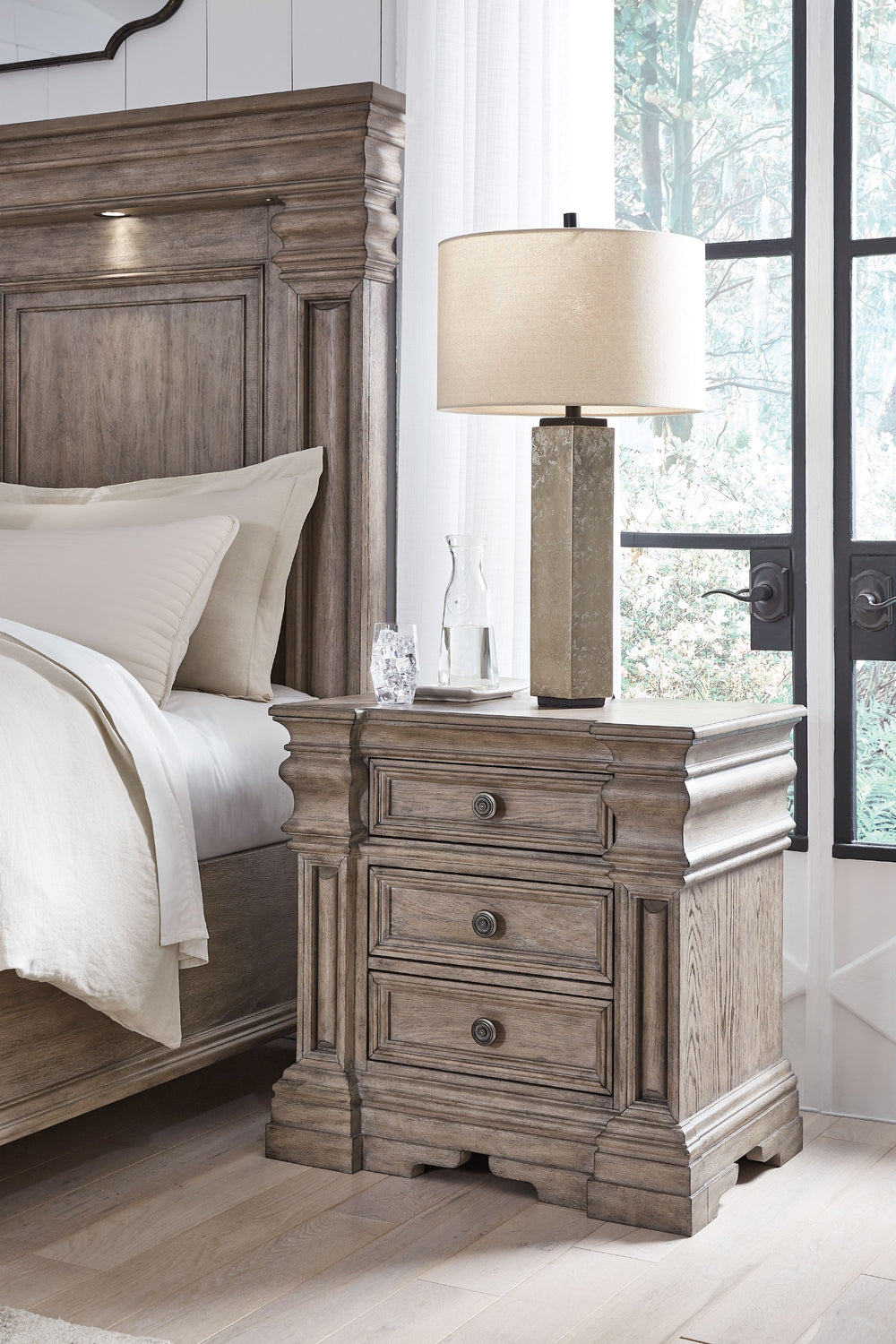 Discover something exceptional with this nightstand. Its impressive silhouette offers a casual traditional aesthetic, embodied by classic-inspired columns and a relaxed grayish brown finish. Casually cool drawers with inset framed fronts are packed with a