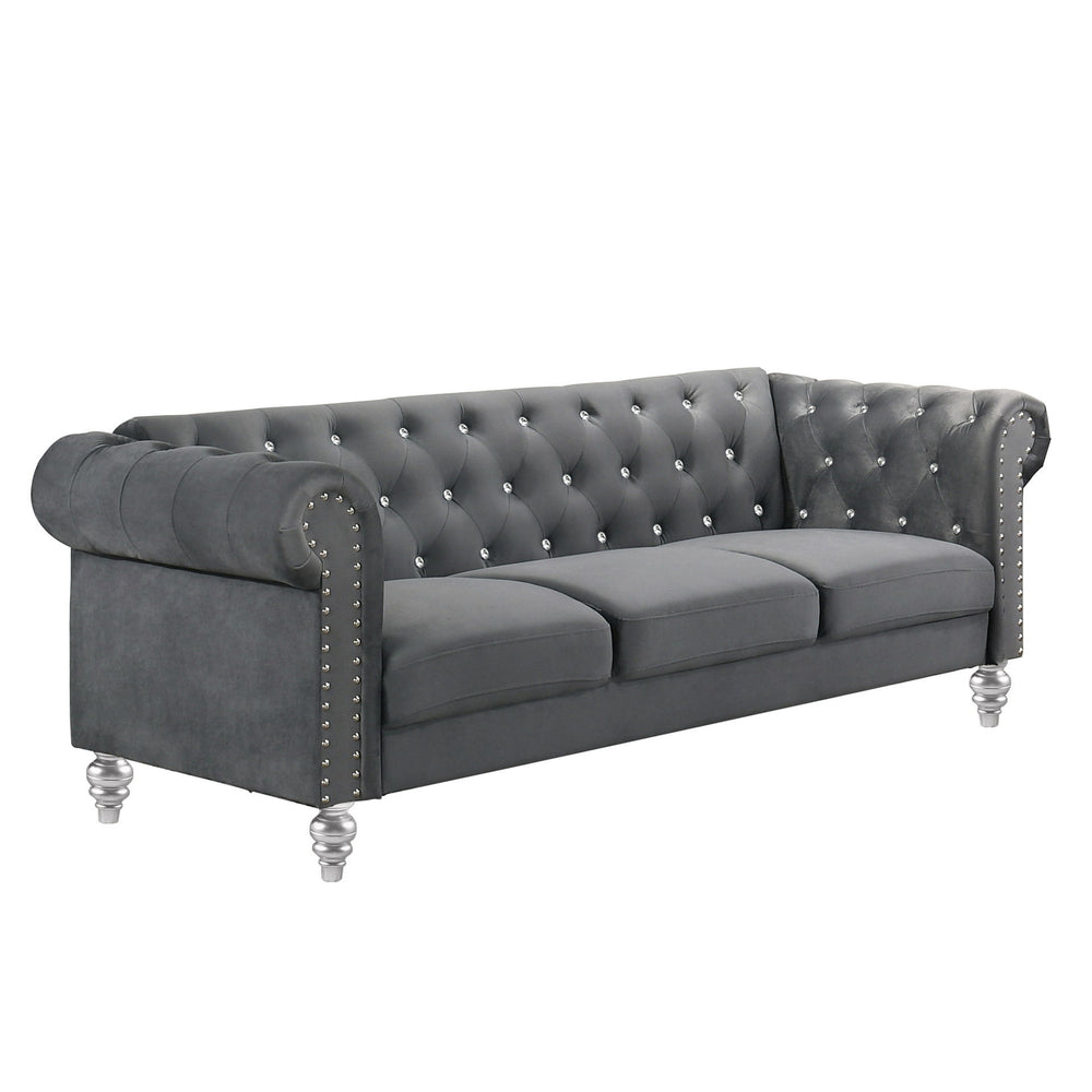 The New Classic Emma Chesterfield Velvet 3 Seat Sofa is a blend of soft elegance and sophisticated design. Crafted from 100% polyester velvet fabric, it offers cozy and indulgent seating for three. The glam tailoring features tufted backs and arms adorned