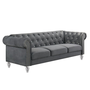 The New Classic Emma Chesterfield Velvet 3 Seat Sofa is a blend of soft elegance and sophisticated design. Crafted from 100% polyester velvet fabric, it offers cozy and indulgent seating for three. The glam tailoring features tufted backs and arms adorned