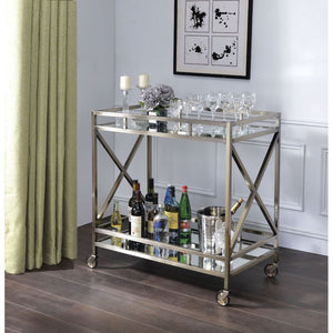 The Kristensen serving cart offers both functionality and superiority for any space in your home. The openwork metal frame finished in antique brass with two-tiered mirror design and the four caster wheelbase effortlessly rolls around. Stack up glossy art