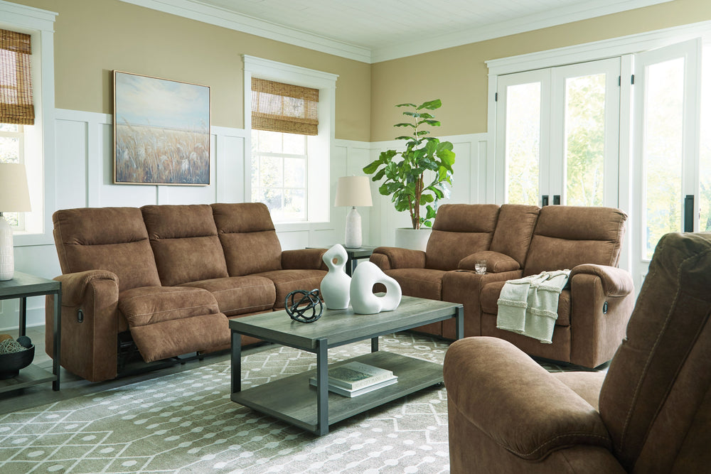 This reclining sofa is your best shot for comfort and total relaxation. Its super soft faux leather, contemporary bustle back and contrast stitching team up for a big win with most any color scheme and room decor. With the pull tab reclining motion, you-'