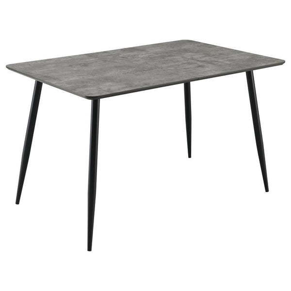 This modern dining table features a sleek grey tabletop finish paired with black tapered legs, creating a sophisticated two-tone design. The table includes a 15. 75-inch butterfly leaf, extending its length from 47. 25 to 63 inches, perfect for accommodat