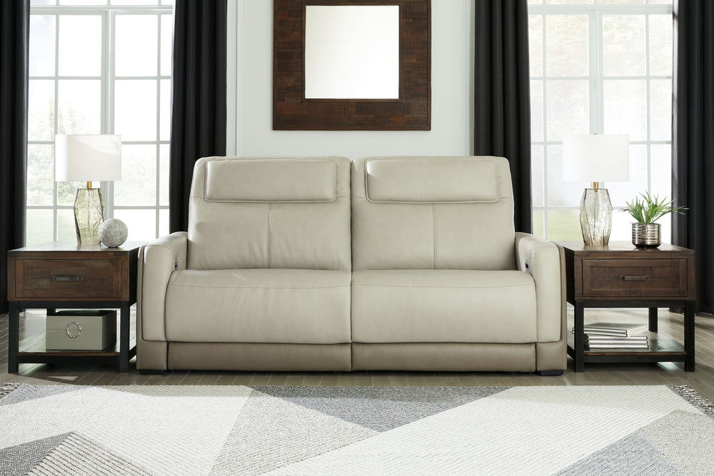 Double down on sleek style with this power reclining sofa. It has a streamlined, space-conscious appeal, with two-tone upholstery in neutral hues creating subtly striking visual intrigue. And with one-touch reclining, adjustable headrests and wireless cha