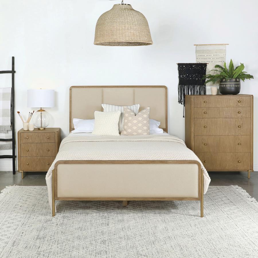 Elevate your coastal bedroom with this stunning panel bed, designed with retro-inspired elements and luxurious details. Cream fabric upholstery on the headboard and footboard is framed by a sleek black edge, creating a bold contrast and soft texture. The 