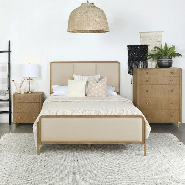  designed with retro-inspired elements and luxurious details. Cream fabric upholstery on the headboard and footboard is framed by a sleek black edge