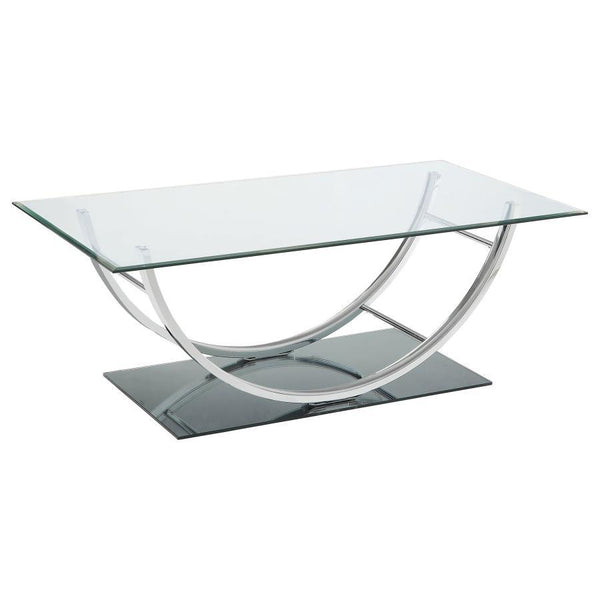 This contemporary rectangular coffee table features a clear tempered glass top and a sleek tempered mirrored base for a polished and modern appeal. The elegantly curved frame, crafted from electroplated heavy gauge metal in a chrome finish, enhances its s