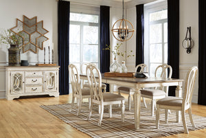Traditional cottage design. Antiqued two-tone finish featuring chipped white with distressed wood finished tops. Tops feature Oak veneers, while the cases are made with birch veneers and hardwood solids. Framed drawer fronts and decorative fret laid over 