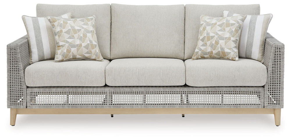 This set is a beautiful addition to any outdoor living space. Resin wicker on an aluminum frame. Wood look paint finish. Nuvella premium high performance fabric. Tempered glass top tables. Stainless steel hardware. <h4><b>Seton Creek - Gray - Sofa with Cu