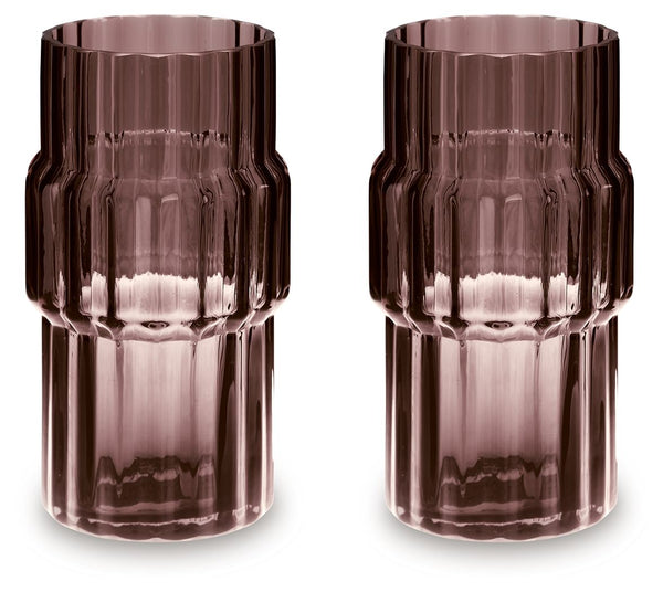 This vase, made of dark mauve-tinted glass, adds a captivating touch to indoor or outdoor decor. Its unique textured shape and oversized fluted details create an elegant art piece. Whether it-'s accentuating flowers or candlelight, this vase is simply str