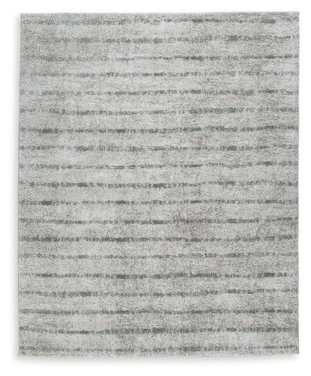 If thereâ€™s any rug that beckons you to slip off your shoes and sink your toes into true comfort, this area rug is it. Just imagine how good the plush woven shag will feel underfoot. And its dreamy, creamy color with sage stripes? The ultimate choice for