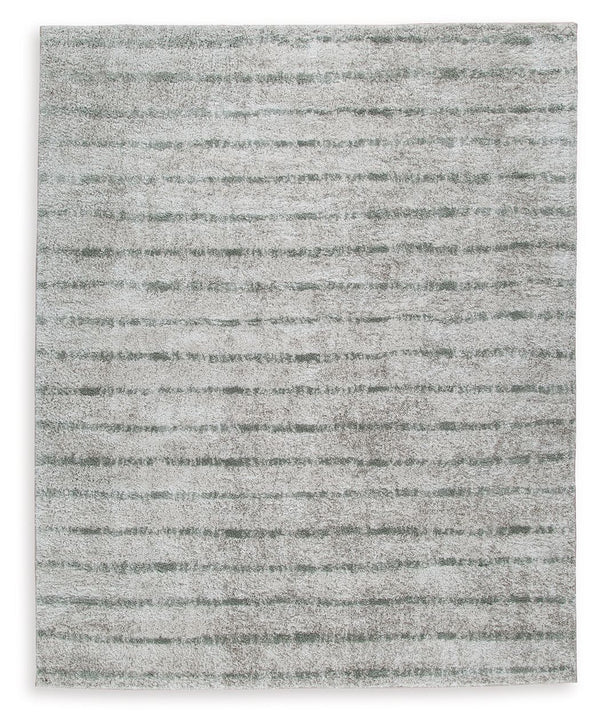If thereâ€™s any rug that beckons you to slip off your shoes and sink your toes into true comfort, this area rug is it. Just imagine how good the plush woven shag will feel underfoot. And its dreamy, creamy color with sage stripes? The ultimate choice for