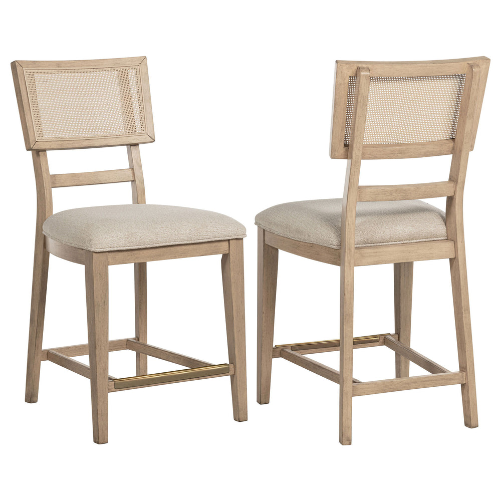 Elevate your dining experience with this stylish counter-height chair, combining natural beauty and modern comfort. Crafted from solid wood, this chair features a hand-woven radio weave cane backrest that adds a light and airy feel to your space. The foam