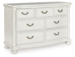 Transform your inner sanctum into a haven of timeless elegance and functionality. This traditionally styled dresser is adorned in a classic antiqued white finish, highlighted by a serpentine-shaped front with thick decorative moulding. Its drawers are pac