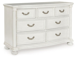 Transform your inner sanctum into a haven of timeless elegance and functionality. This traditionally styled dresser is adorned in a classic antiqued white finish, highlighted by a serpentine-shaped front with thick decorative moulding. Its drawers are pac