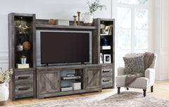 This entertainment center is sure to win your heart with its daring designer take on modern rustic. Its crisp, clean and minimalist-chic profile is enriched with a striking replicated oak grain with thick plank styling and a weathered gray finish for that