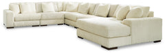 Plush and posh. Showcase your eye for on-trend texture with the statement-making cord upholstery of this sectional with chaise. Its stunningly soft fabric entices in an ivory hue, complementing contemporary color palettes. Sink into the cushions and plan 