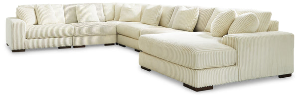 Plush and posh. Showcase your eye for on-trend texture with the statement-making cord upholstery of this sectional with chaise. Its stunningly soft fabric entices in an ivory hue, complementing contemporary color palettes. Sink into the cushions and plan 