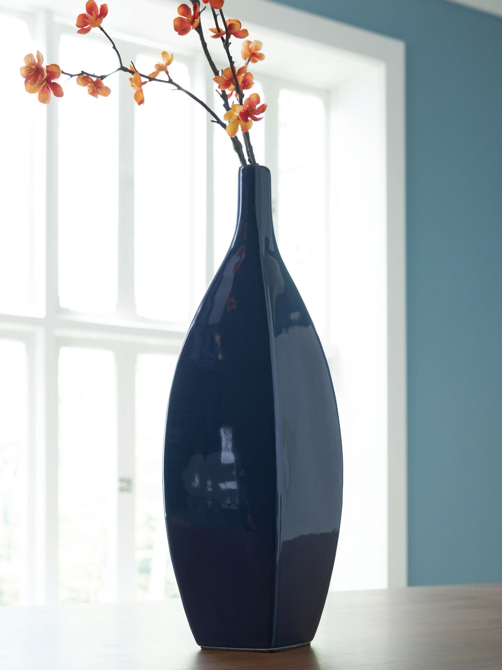 This vase is an effortless display of versatile style. Its navy blue hue makes a chic statement, whether hosting faux florals or standing alone. Sprucing up your outdoor oasis? The vase is durable enough for alfresco use, so you can add decorative flair w