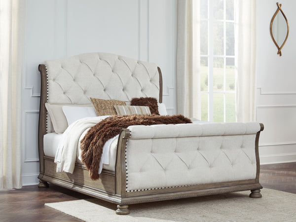  glazed antiqued-look finish and tufted cushions. Talk about stun