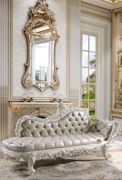 Luxurious style, sophisticated charm, and lustrous finishes are all included in the Vanaheim Bedroom Collection. Extravagant scroll floral design with gold trim accent creates classic appeal and timeless silhouettes. Button tufted headboard and footboard 