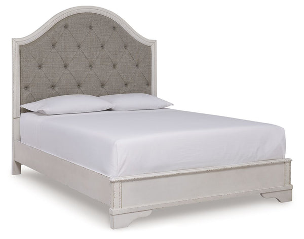 Traditional design. Casual appeal. You can have it all with this queen upholstered panel bed. A relaxed chipped white finish and an inset headboard cushion with classic button tufting give the distinctive piece an allure all its own. And the low-profile s