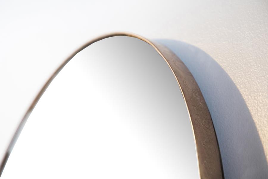 This full-length floor mirror features a striking arched silhouette with a minimalist metal frame. Designed for vertical mounting or floor placement, its slim profile delivers a clean, contemporary look. The expansive glass surface provides a complete hea