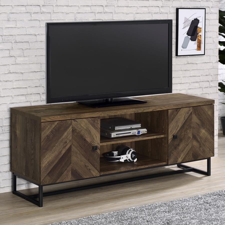 This rustic TV console offers a modern touch to a farmhouse style living room. A rustic oak finish showcases the classic herringbone pattern across the double cabinet doors. Supported on a metal trestle base in a gunmetal finish that offers an industrial 