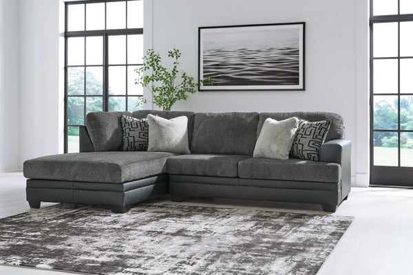  it pairs cozy fabric with faux leather for invitingly cool character. And with a roomy chaise offering extra seating space