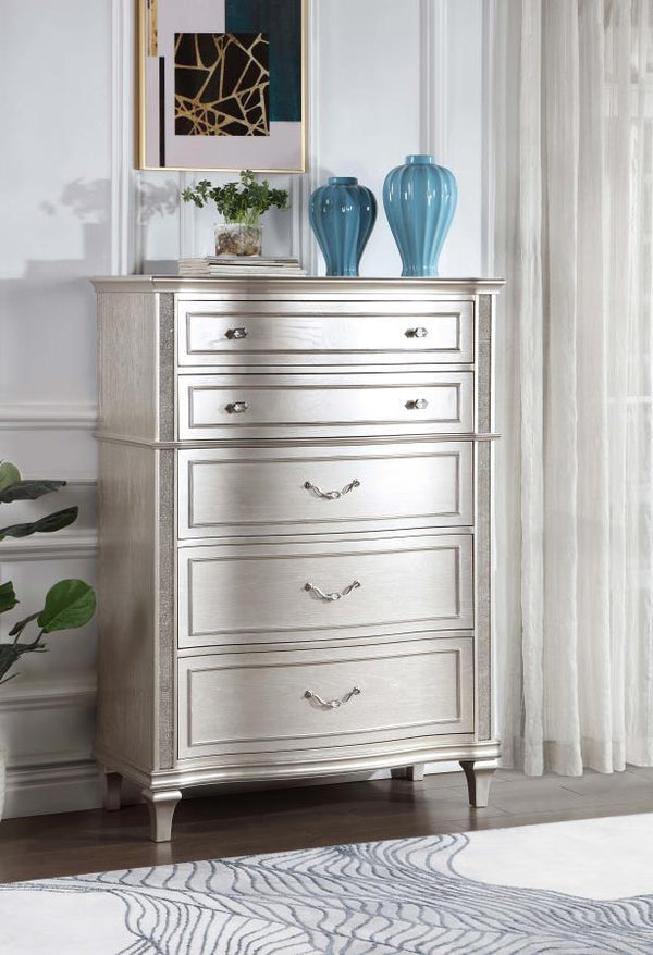  seen throughout the wavy wood trim appointed drawer panels. Five spacious drawers offer ample space for all your bedroom n