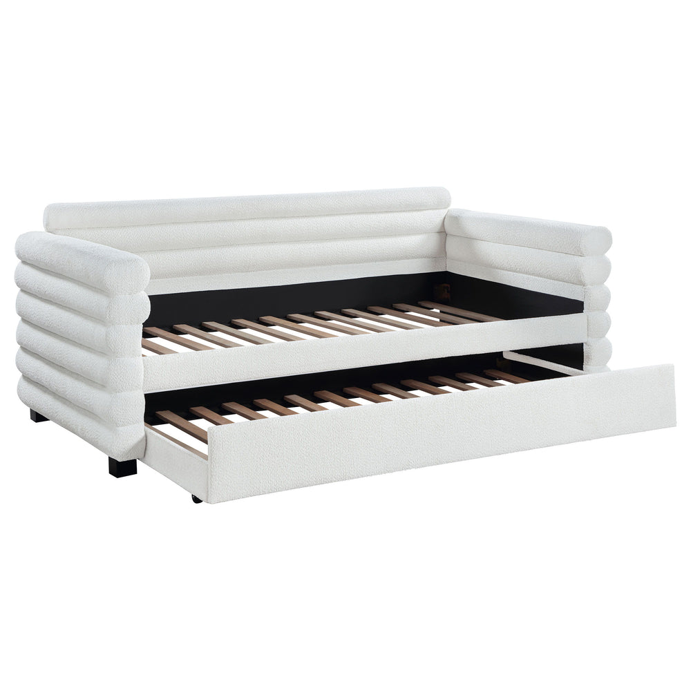 You-'re going to love the intriguing silhouette and boucle upholstery featured on this modern daybed and trundle. Offering contemporary flair, the daybed is designed with layered round bolsters, creating exceptional texture and dimensionality in your livi