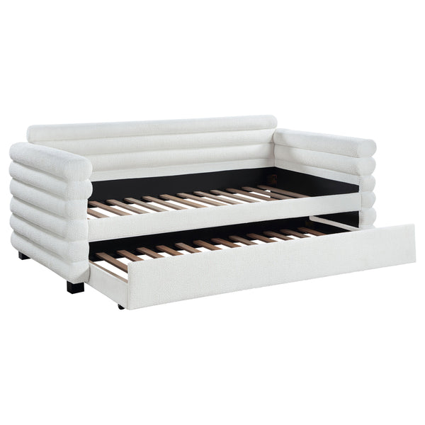 You-'re going to love the intriguing silhouette and boucle upholstery featured on this modern daybed and trundle. Offering contemporary flair, the daybed is designed with layered round bolsters, creating exceptional texture and dimensionality in your livi