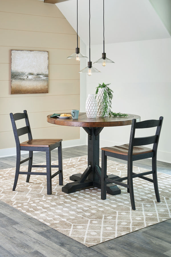 This set serves up the best in cottage styling. A charming choice, its two-tone finish is versatile enough for many casual aesthetics. Round counter height table features a sturdy post and bracket base design in a rustic black finish with a thick 48-" rou