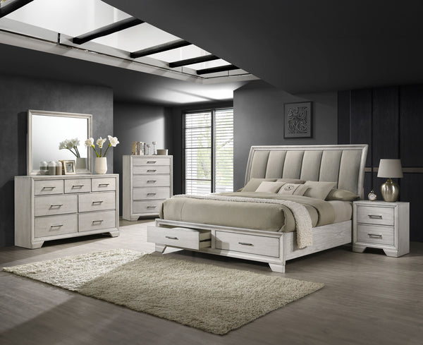 This bedroom set offers a sleek and stylish update to any space, featuring a white mist finish that commands attention while maintaining a sense of warmth and coziness. The bed stands as the stunning centerpiece, with its high, padded headboard upholstere