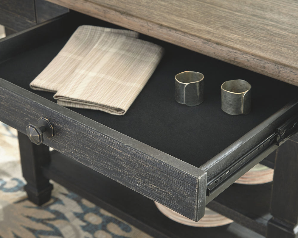Invite your family into the heart of your home with this rectangular counter height dining room table. A beautifully textured black finish and a timeworn planked oak top create a unique two-tone contrast. The base provides plenty of storage for wine bottl