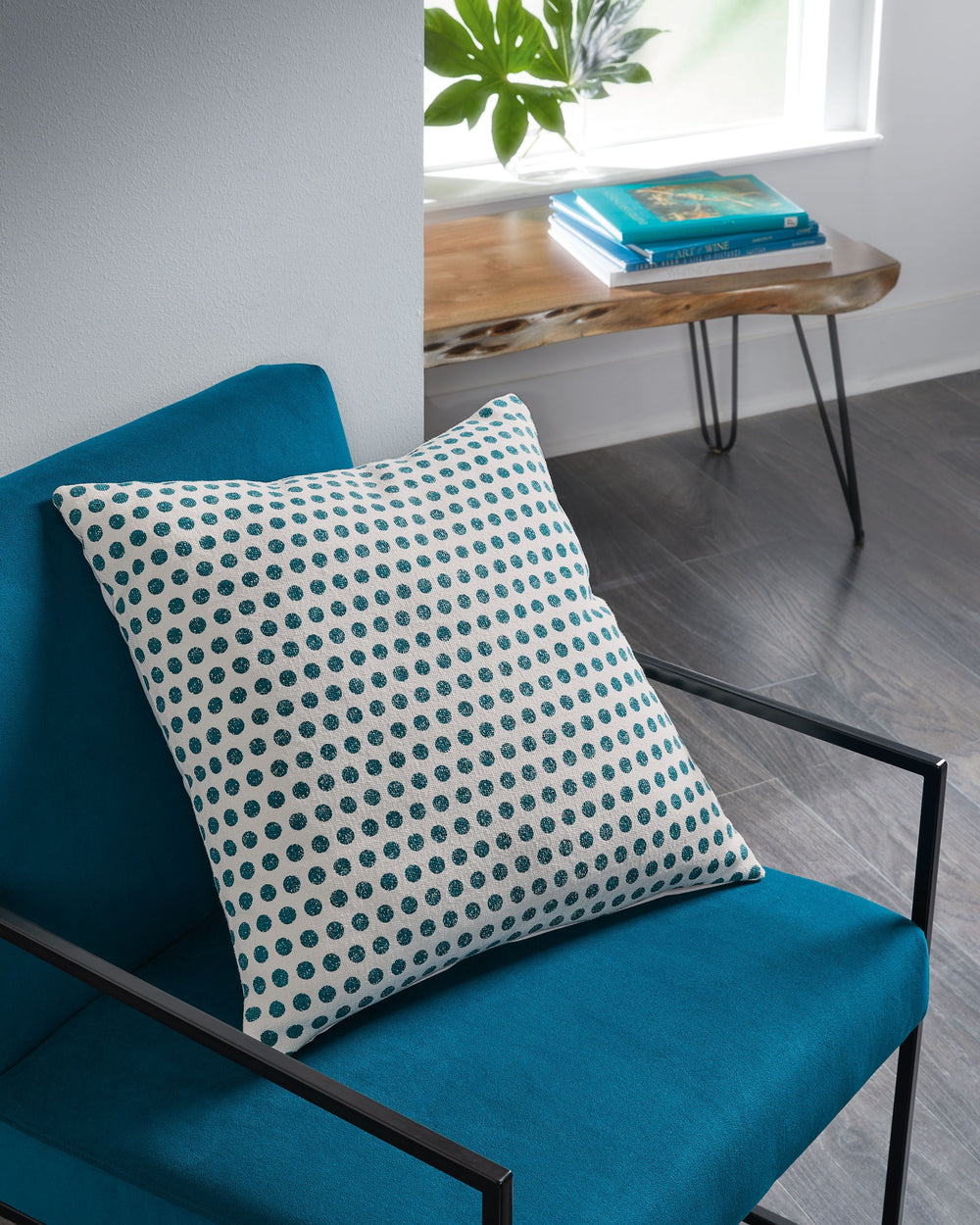 Enhance your at-home accents with the reserved excitement of this pillow. Teal dots decorate a white background, balancing a bold design with classic construction. Pairing a posh look with the plush softness you crave, this pillow makes for a cozy additio