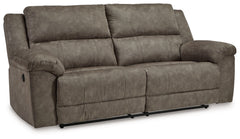 Is being too comfortable even possible? Itâ€™s worth finding out in this reclining sofa. Wrapped in the plushest of neutral faux leather upholstery, it-'s perfectly cushioned in all the right places. We love the sofa-'s super-wide seating, with plenty of 