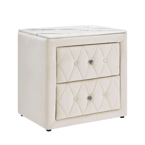 This elegant nightstand brings a touch of luxury to any bedroom with its rich, velvety texture and diamond-patterned tufting. The soft, plush exterior is complemented by gleaming crystal-like drawer knobs, adding a hint of glamour. With two spacious drawe