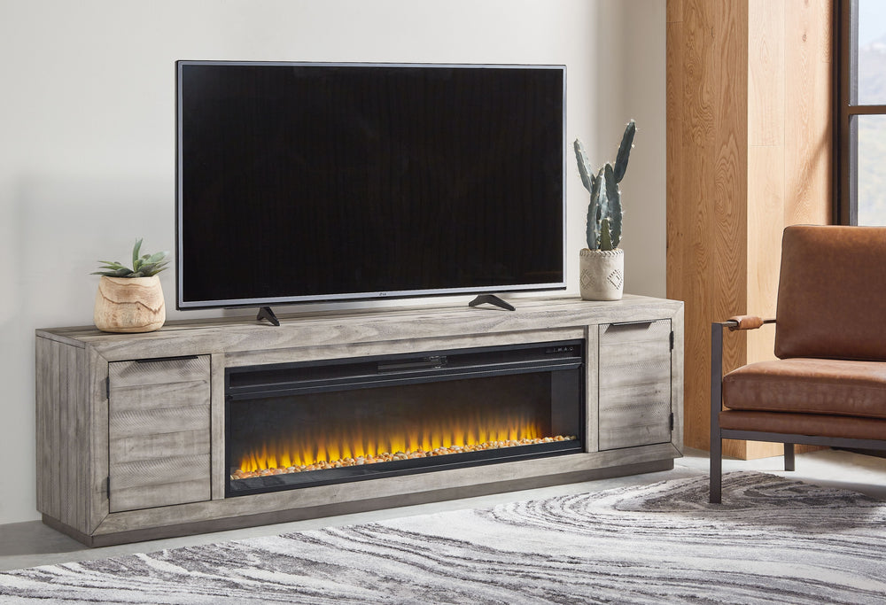 Balancing chic flair with a relaxed sensibility, this extra-large TV stand strikes just the right tone for rustic sophistication. Beautifully clean lines are subtly enhanced with relaxed distressing and saw marks for authentic barn wood character. Adding 