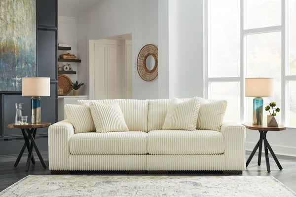 Plush and posh. Showcase your eye for on-trend texture with the statement-making cord upholstery of this sectional loveseat. Its stunningly soft fabric entices in an ivory hue, complementing contemporary color palettes. Sink into the cushions and plan to 