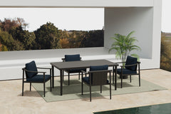 Experience outdoor dining in style with the Moana 5 Piece Outdoor Patio Dining Set, featuring a durable table and four side chairs with comfortable blue cushions. The aluminum frames boast a baked-on powder coat finish, providing a strong foundation that 